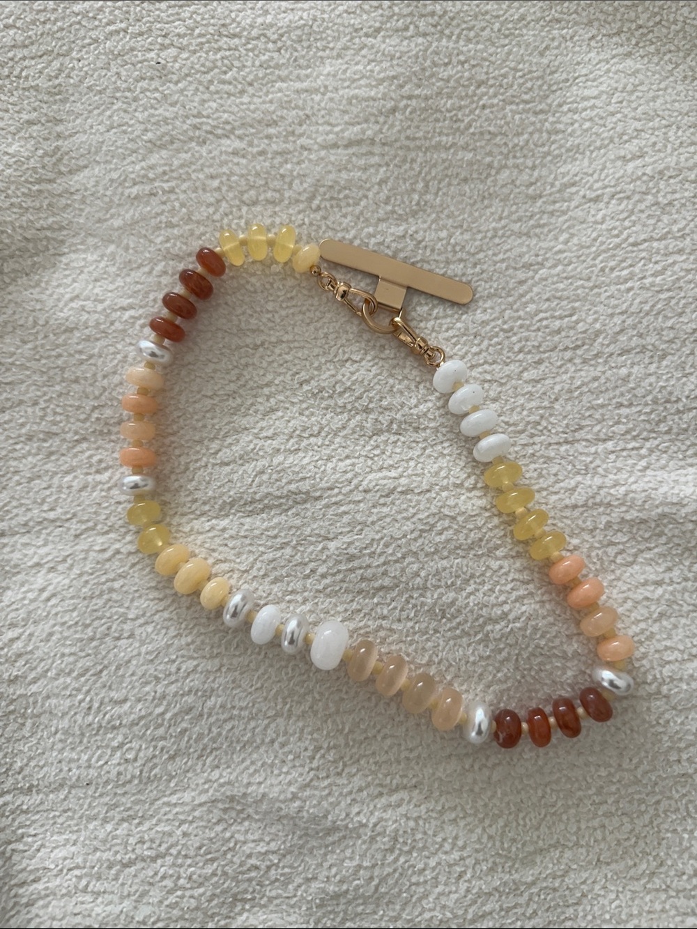 Anthro Multicolor Beaded phone charm / holder